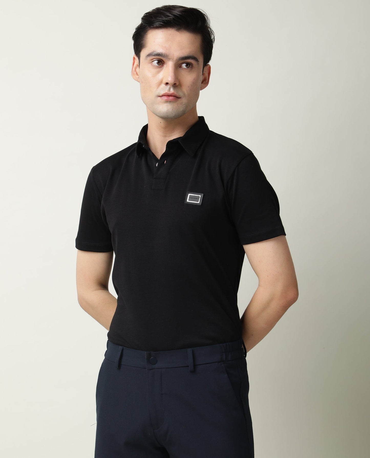 Rare Rabbit Men's Badge Black Cotton Fabric Collared Neck Half Sleeves Polo T-Shirt