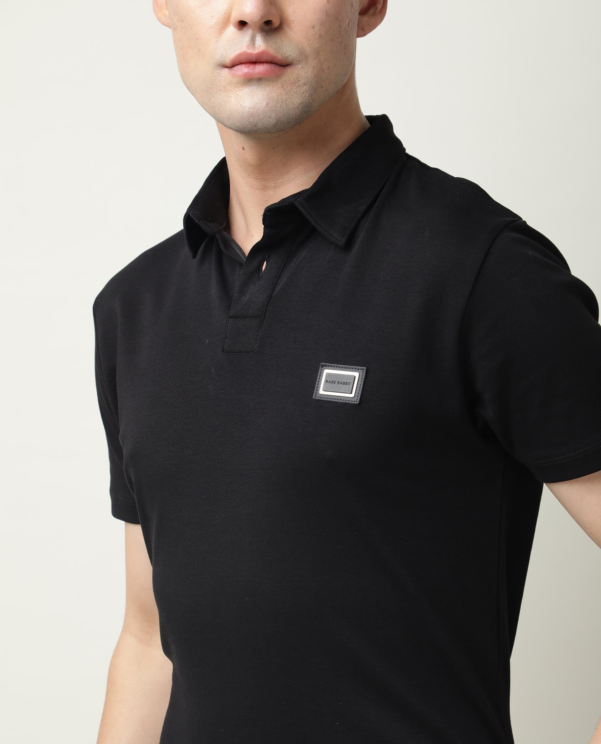 Rare Rabbit Men's Badge Black Cotton Fabric Collared Neck Half Sleeves Polo T-Shirt