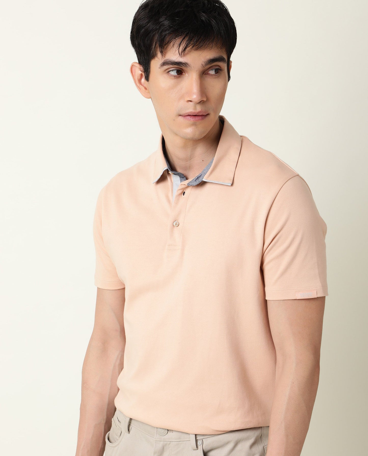 Rare Rabbit Men's Zap Peach Solid Cotton Fabric Collared Neck Half Sleeve Polo T-Shirt