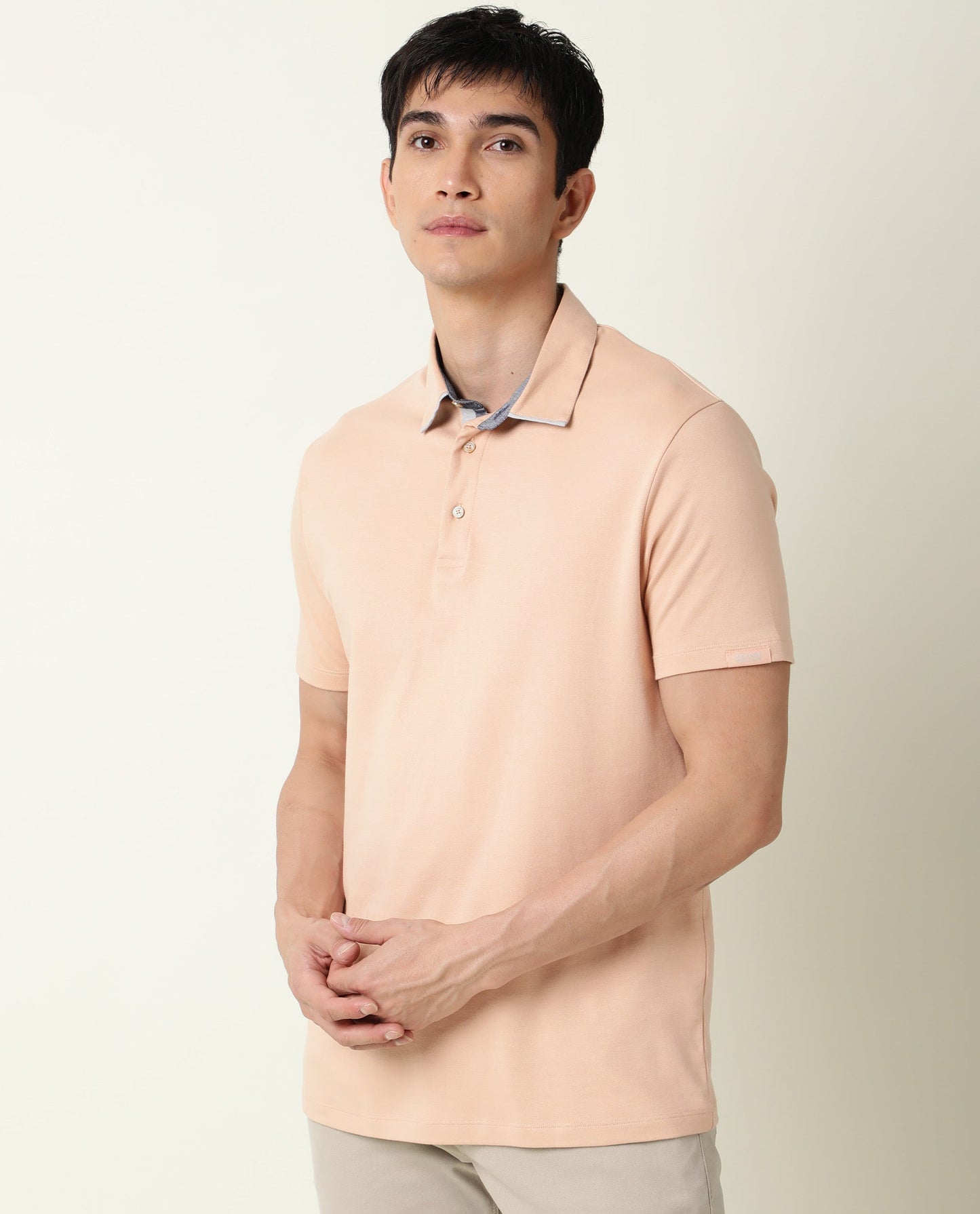 Rare Rabbit Men's Zap Peach Solid Cotton Fabric Collared Neck Half Sleeve Polo T-Shirt