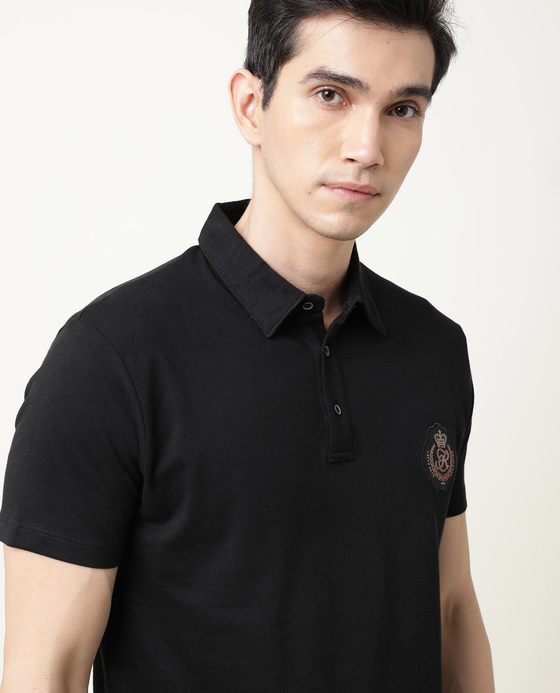 Rare Rabbit Men's Crown P Black Solid Cotton Fabric Collared Neck Chest Crown Badge Half Sleeve Polo T-Shirt